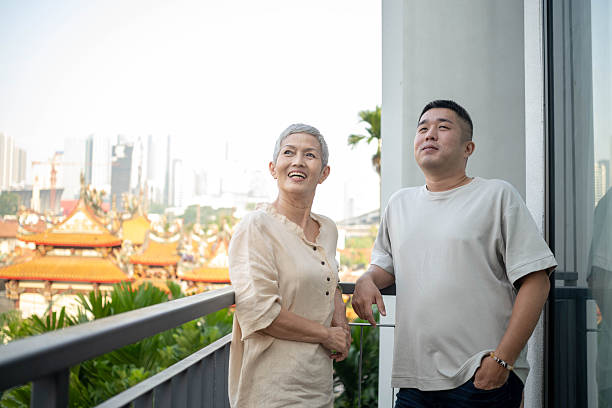A candid moment capturing the laughter and emotional connection between a mother and her son.