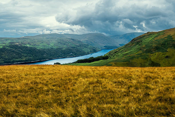 Beautiful aerial drone landscape image of glorious Autumn Fall sun over Thirlmere in Lake District