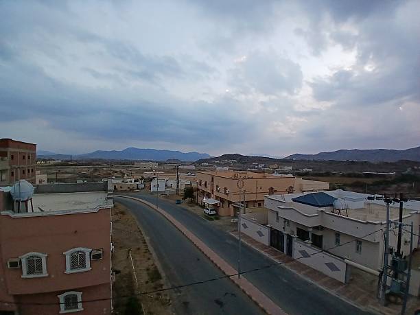 istock White and gray clouds and dramatic sky over a small town 2252346031