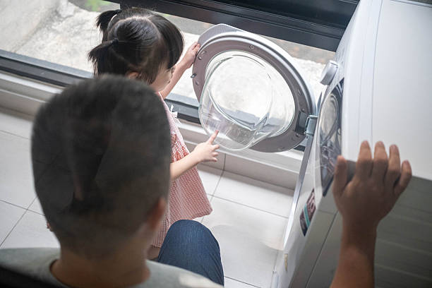 istock Father Guiding Child Through Daily Tasks 2252346460