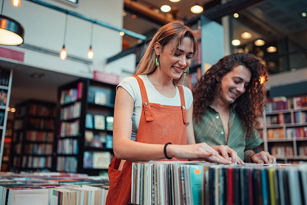 istock Young adults browsing vinyl records in music store 2252352621
