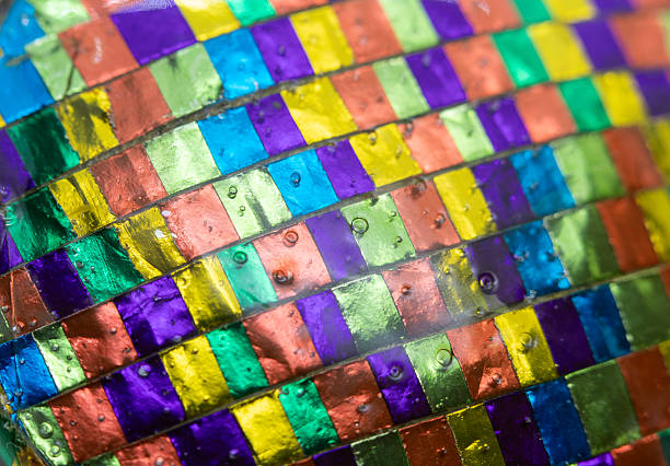 Varnished multicolored texture composed of squares, background.