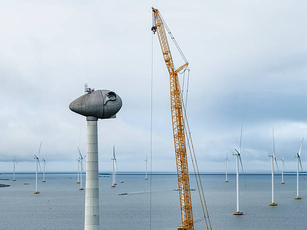 istock Wind turbine construction with huge cranes at a wind park 2252354037