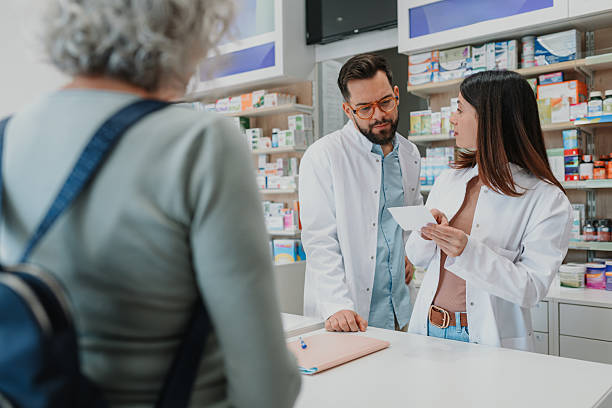 istock Pharmacists advising senior customer about medication prescription 2252355883