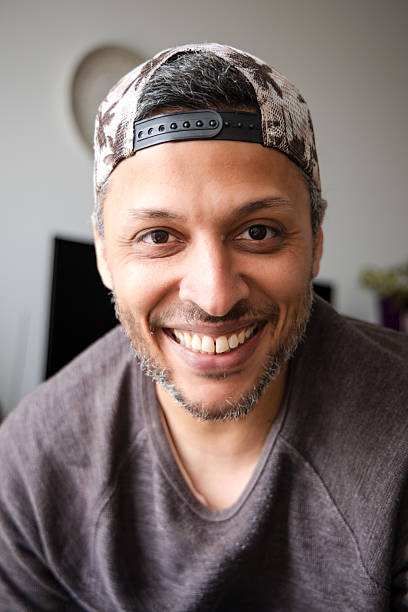 istock A man wearing a hat and a gray shirt is smiling 2252356067