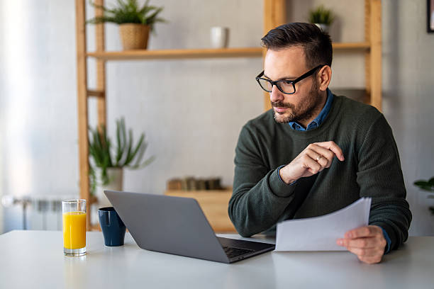 istock Success man typing on laptop, communicating online distantly working or studying on computer at home 2252357136