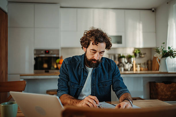 istock Man concentrating on home work with laptop 2252357829
