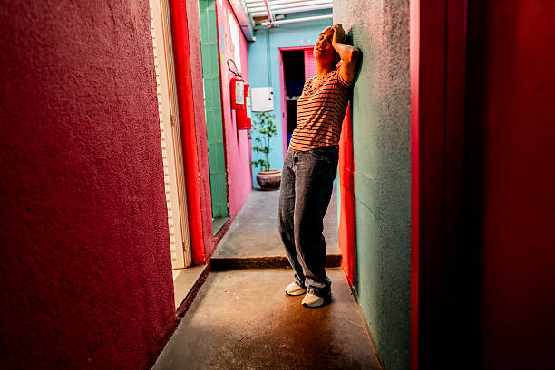 istock Young woman with headache on hostel corridor 2252357922