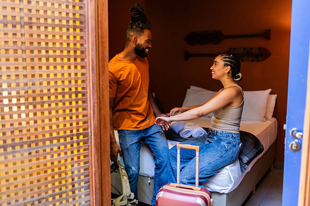 istock Young couple talking on hotel room 2252357980