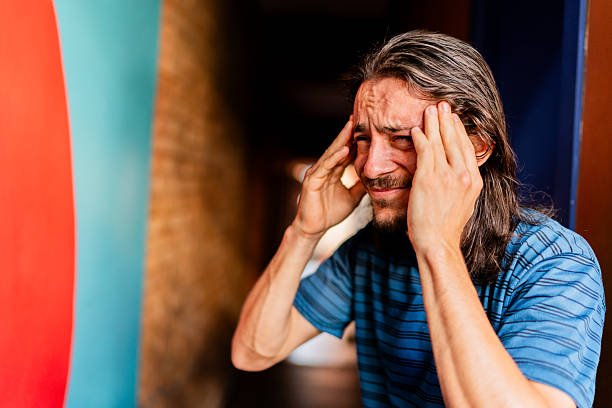 istock Mid adult man with headache 2252358049
