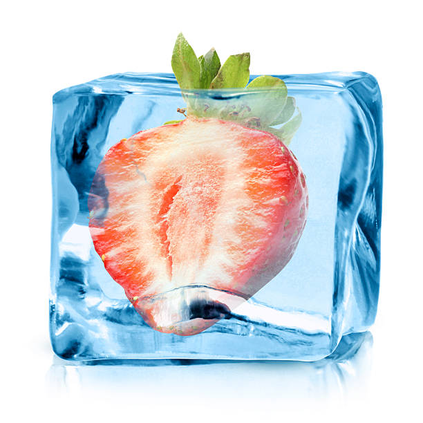 istock Half of fresh strawberry in ice cube isolated on white 2252358562