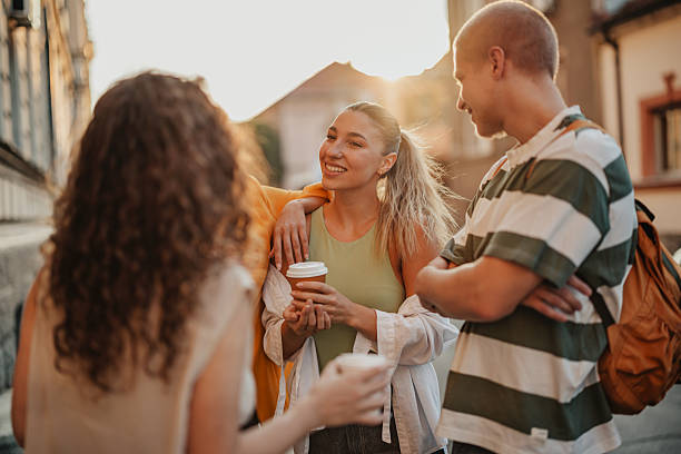 istock Young University students enjoy coffee break on campus on a sunny afternoon, sharing friendship and laughter 2252361590