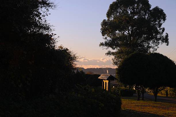 From the park bathed in the morning sun, we could see the mountains beneath the cloudy sky.