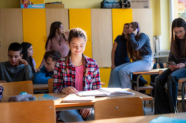 istock Teenage students studying in busy high school classroom 2252362745