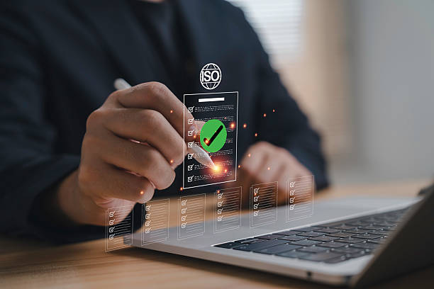 istock A professional hand approve a digital checklist with ISO symbol on a laptop screen for ISO audit certification compliance quality management system inspection documentation and business standard 2252364158