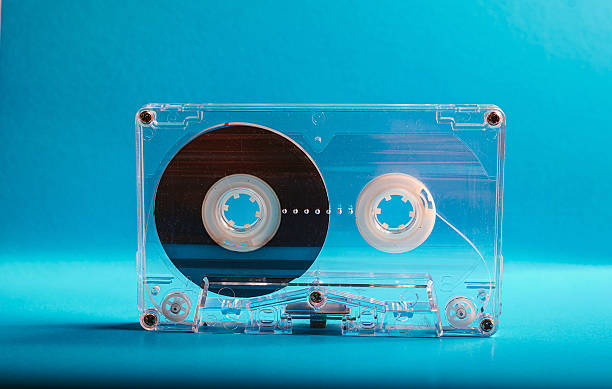 istock Vintage Clear Cassette Tape on turquoise background 2252364582