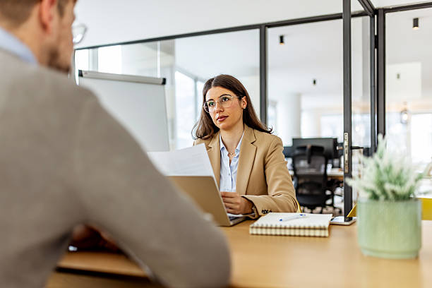 istock Professional Business Meeting Between Colleagues In A Modern Office With Documents And Laptop 2252365747