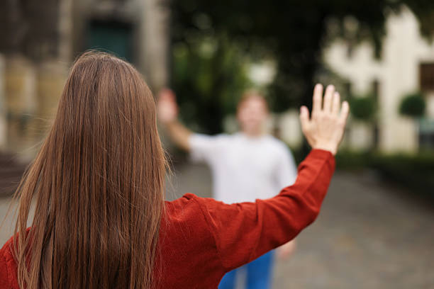 istock Goodbye. Woman waving to her boyfriend outdoors, selective focus 2252367020