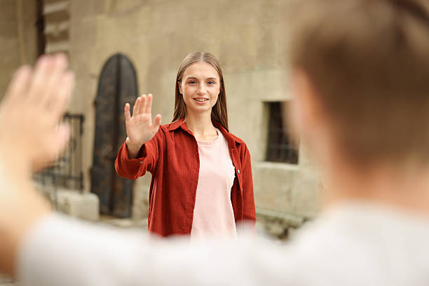 istock Goodbye. Man waving to his girlfriend outdoors, selective focus 2252367414