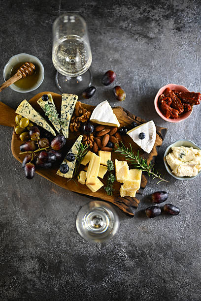 istock Cheese board with wine, grapes, nuts, and charcuterie 2252369088
