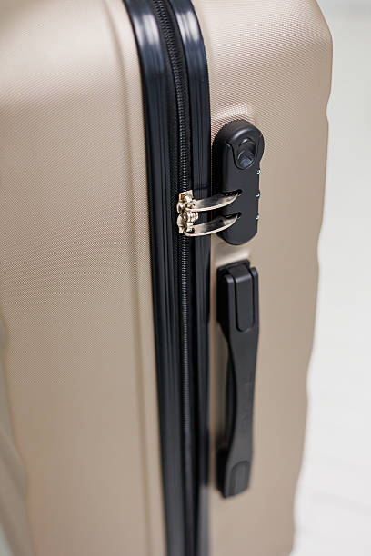 istock Golden suitcases with wheels isolated on white background. Suitcase for things. A suitcase for a tourist 2252369944