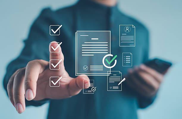 istock business professional interacting with digital checkmarks and document icons, illustrating approval workflow, document verification, and efficient digital process management in modern organizations. 2252373380