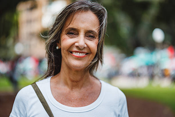 istock Mature Caucasian Woman Smiling Warmly Outdoors in Natural Setting 2252373690