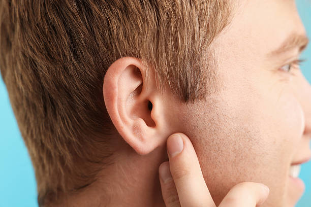 istock Sound. Man on light blue background, closeup 2252376012