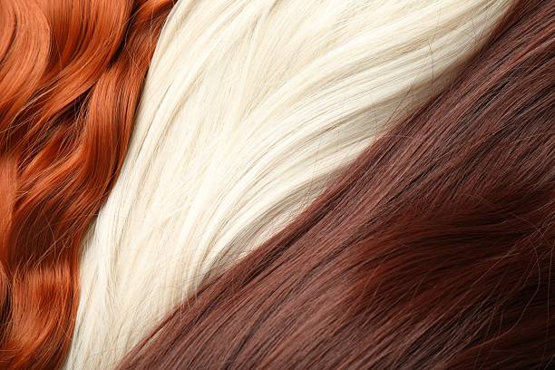 istock Strands of different beautiful hair as background, top view 2252377427