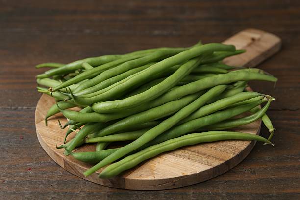 istock Fresh green bean pods on wooden table, closeup 2252379234
