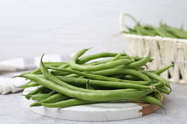 istock Fresh green bean pods on grey table, closeup 2252379244