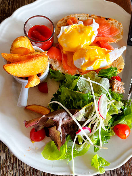 Bread with salmon and salad and fried potatoes