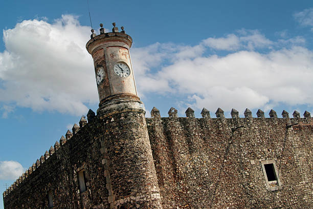 istock Fortress wall with tower and clock in Guernavaca Mexico 2252380243