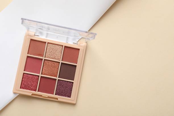 istock Beautiful eyeshadow palette on beige background, top view. Space for text 2252380905