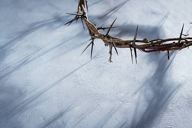 istock Crown of thorns casting a distinct shadow a white background, creating a symbolic easter image of suffering, sacrifice, and remembrance Copy good text friday for space 2252381636