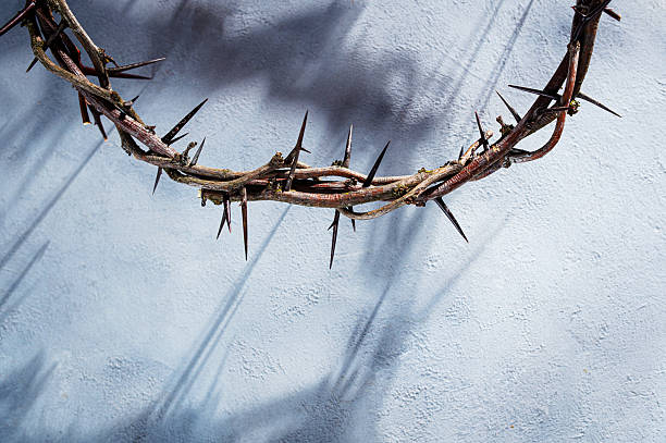 istock Crown of thorns casting a distinct shadow a white background, creating a symbolic easter image of suffering, sacrifice, and remembrance Copy good text friday for space 2252381644