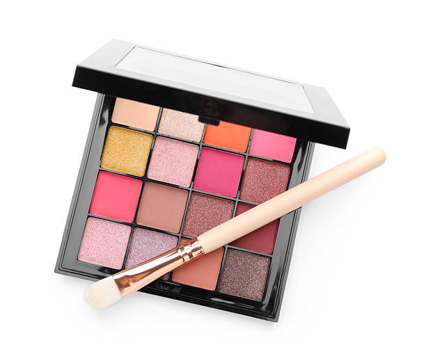 istock Beautiful eyeshadow palette with brush isolated on white, top view 2252381705