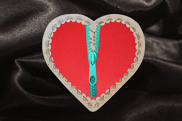 Romanticism, an open heart on a black satin sheet