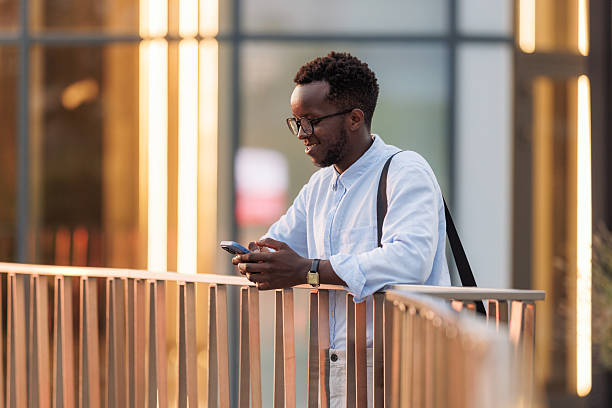 istock Young businessman using smartphone outdoors 2252385583