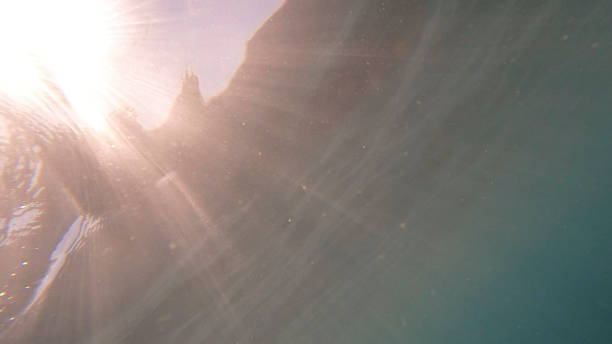 Underwater view of sea surface and sunlight, Liguria