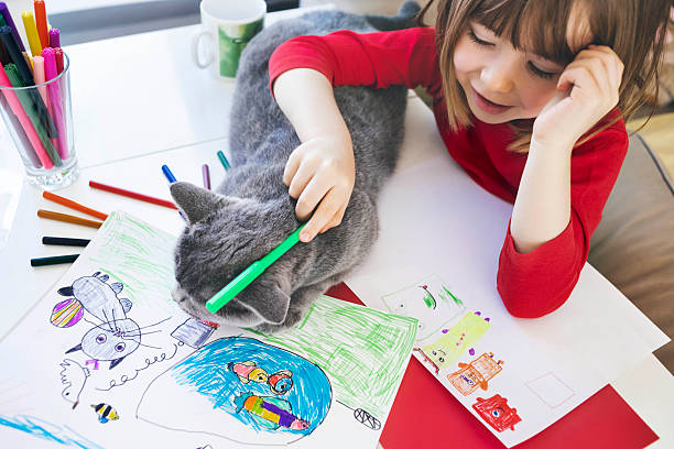istock A child draws and plays with his pet 2252387462