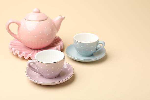 istock Beautiful ceramic tea set for children on beige background, closeup. Space for text 2252388056