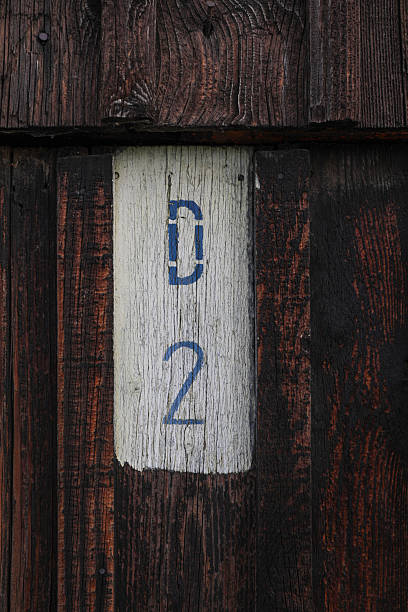 istock Rustic Wooden Wall With Weathered D2 Marking 2252390353