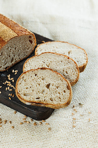 istock Slices of sliced fresh rye bread. Sliced kraft bread. 2252394298