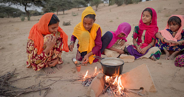 istock Indian children preparing chai - masala tea 2252395419