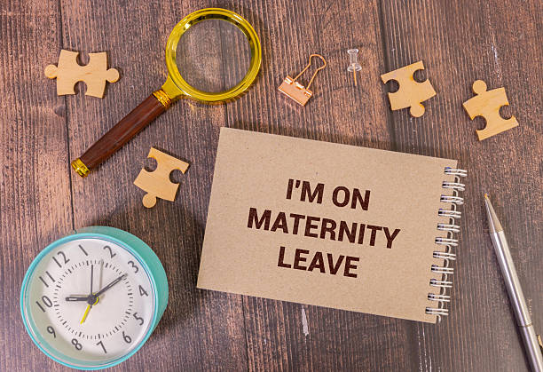 istock Recycled paper note pinned on cork board.I'm on Maternity Leave Message. 2252395503