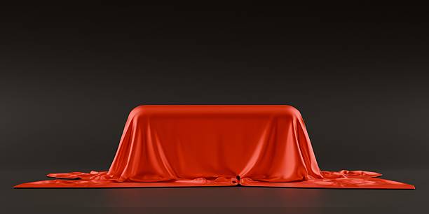 istock silky red satin cloth stage podium, on dark background 2252396975