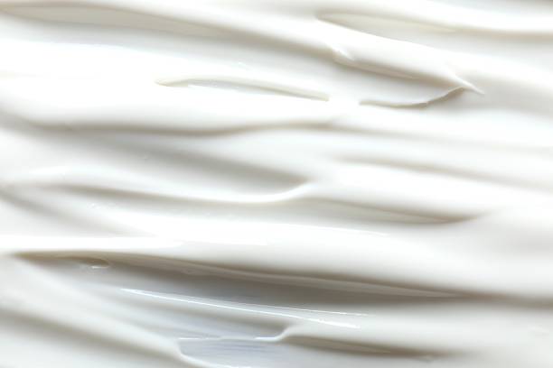 istock White cream as a background. close up 2252403109