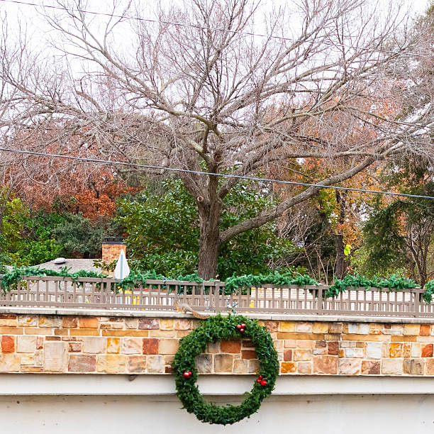 istock Green wreath hanging on a bridge 2252406268