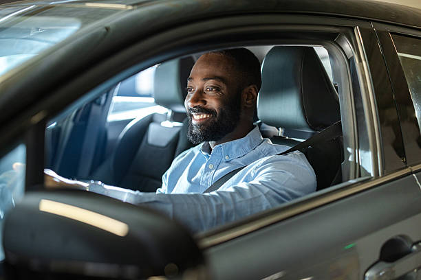 istock Smiling man driving a car during commute, enjoying a comfortable and confident ride 2252406910